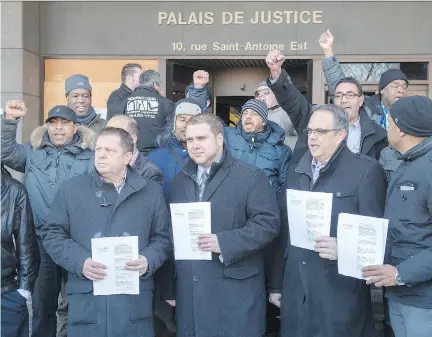  ?? RYAN REMIORZ/THE CANADIAN PRESS ?? Taxi drivers gather outside a Montreal courthouse where they are seeking an injunction against ride-sharing firm Uber.