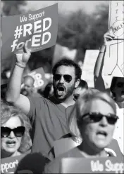  ?? ASSOCIATED PRESS ?? ARIZONA TEACHERS AND EDUCATION ADVOCATES SHOUT IN UNISON as they march at the Arizona Capitol protesting low teacher pay and school funding Wednesday in Phoenix.