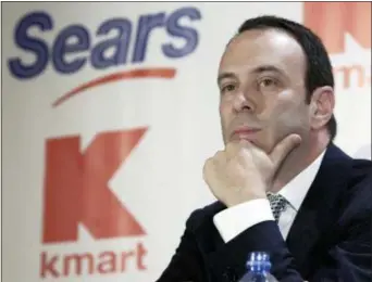  ?? GREGORY BULL — THE ASSOCIATED PRESS FILE ?? FILE- In this file photo Kmart chairman Edward Lampert listens during a news conference to announce the merger of Kmart and Sears in New York.