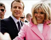  ?? ALEX WONG / GETTY IMAGES ?? The Macrons greet well-wishers Monday at the Lincoln Memorial in Washington. Trump and Macron will meet for talks today in the Oval Offiffice.