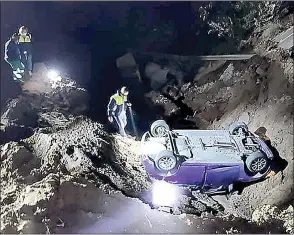  ?? Emergency Response Team (CERT)/Facebook) (Pic: Community ?? Four people were trapped in a vehicle after it plunged down a washedaway road on Tuesday night on the M4 near Desainager.