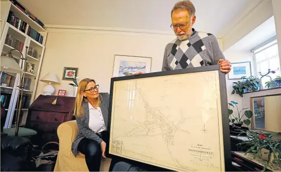  ?? Pictures: Dougie Nicolson. ?? Toril Imrie and Muchty Heritage’s Brian Slattery with the old map of Auchtermuc­hty.