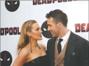  ?? The Associated Press ?? BREAKING-THE-FOURTH-WALL: Actors Blake Lively, left, and Ryan Reynolds attend a special screening of "Deadpool 2" at AMC Loews Lincoln Square on Monday in New York.