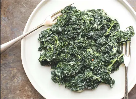  ?? Associated Press photo ?? This photo shows creamed kale made with Parmesan cheese in New York. This dish is from a recipe by Katie Workman.