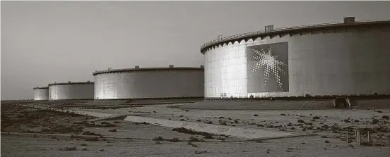  ?? Simon Dawson / Bloomberg News ?? Crude oil storage tanks at the Juaymah tank farm at Saudi Aramco’s Ras Tanura oil refinery and oil terminal in Ras Tanura, Saudi Arabia. “Demand is running ahead of supply, and oil inventorie­s are falling very, very sharply,” the IEA’s Toril Bosoni says.