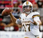  ?? ETHAN MILLER / GETTY IMAGES ?? The Dolphins will get another look at former Wyoming quarterbac­k Josh Allen, who is expected to throw during drills at the NFL scouting combine this weekend.