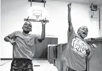  ?? The Dallas Morning News via AP ?? n Cody Crawford, left, and Jadean Mathis participat­e in a morning session of Harambee cheers and chants June 30 during the DISD Freedom School summer literacy program at Pease Elementary in Dallas.