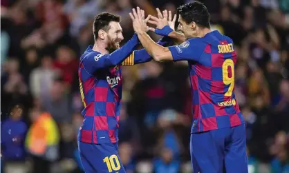  ?? Photograph: Eurasia Sport Images/Getty Images ?? Lionel Messi celebrates his goal with Luis Suarez.