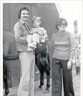  ?? COURTESY CYSTIC FIBROSIS FOUNDATION ?? At the height of his fame in the 1970s, Burt Reynolds helped Mary Weiss (right) raise money for cystic fibrosis research. The disease affects 30,000 children and young adults in America. In the ’70s, this little girl’s life expectancy was about 12....