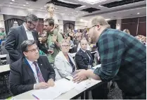  ?? PAUL CHIASSON/THE CANADIAN PRESS FILES ?? A demonstrat­or confronts Montreal Mayor Denis Coderre during an August 2016 hearing into the Energy East project in Montreal. Saint John Mayor Don Darling blamed opponents of the project in Quebec and the regulatory process for Energy East’s demise.