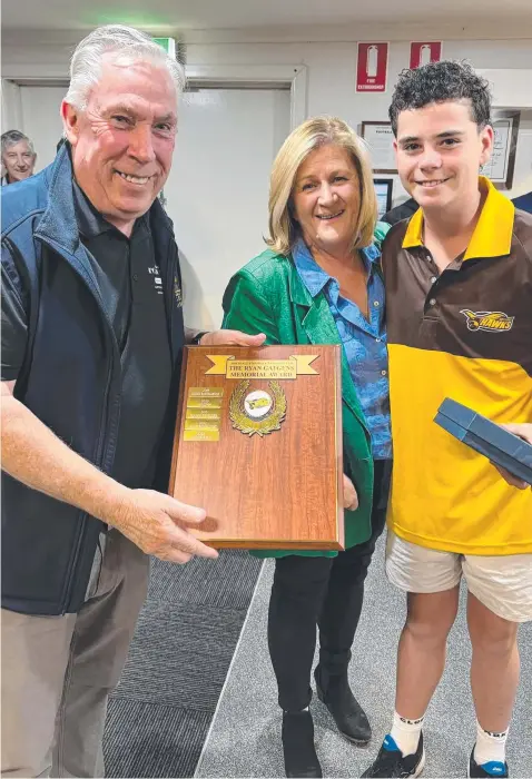  ?? Picture: Drysdale Football Club ?? Cooper Bell receives the prestigiou­s Ryan Gatgens Memorial Trophy for his contributi­ons to the Hawks.