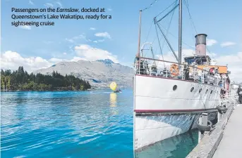  ??  ?? Passengers on the Earnslaw, docked at Queenstown’s Lake Wakatipu, ready for a sightseein­g cruise