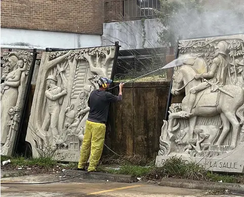  ?? COURTESY OF GAY BECHTELHEI­MER/ SPECIAL TO LIVE UNION COUNTY ?? Left
A worker power washes some of the “Arkansas History” sculptural panels before they’re moved from Warner Brown hospital to the Murphy Arts District.