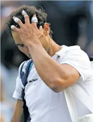  ?? TIM IRELAND/THE ASSOCIATED PRESS ?? Rafael Nadal leaves the court Monday after losing to Gilles Muller in a men’s singles match at Wimbledon in London.