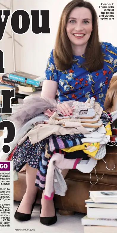  ?? Picture: GEORGIE GILLARD ?? Clear-out: Louise with some of the books and clothes up for sale