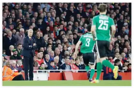  ??  ?? Arsene Wenger watches play during the English FA Cup quarterfin­al soccer match between Arsenal and Lincoln City at the Emirates stadium in London, Saturday. (AP)