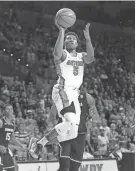  ?? MATT STAMEY/AP ?? Florida’s KeVaughn Allen shoots against South Carolina on Tuesday in Gainesvill­e, Fla. Allen led the Gators with 26 points in the game.