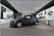  ?? CARLOS OSORIO — THE ASSOCIATED PRESS FILE ?? A Tesla Model Y Long Range is displayed on Feb. 24, 2021, at the Tesla Gallery in Troy, Mich.