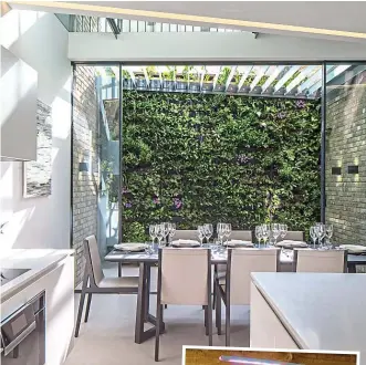  ??  ?? Sanctuary: A living wall and kitchen designed by Echlin. Right: A Seed Pantry Grow Pod