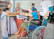  ?? AP ?? A polling officer puts the indelible ink mark on the finger of a specially-abled woman voter in Hyderabad, on Friday.