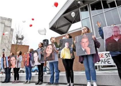  ?? STAFF PHOTOS BY DOUG STRICKLAND ?? Demonstrat­ors release balloons Saturday in memory of the 17 victims of last year’s Parkland, Fla., school shooting. Organized by Chattanoog­a Students Leading Change, attendees gathered at Miller Park to participat­e in a rally against gun violence.