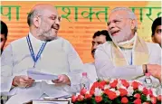  ?? — PTI ?? Prime Minister Narendra Modi with BJP president Amit Shah during the party’s National Council Meeting at Kozhikode on Sunday.