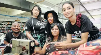  ?? ?? AFRICAN Fashion Internatio­nal Fastrack finalist designers vying for the title of Young Designer at next week’s Joburg Fashion Week complete their designs at Kingsgate Clothing in Durban. From left are Siyabonga Mtshali, Cheron Dreyer, Kene Mhletshwa, seamstress Anusha Jairaj and Shamyra Moodley. | SHELLEY KJONSTAD African News Agency (ANA)