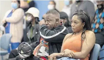  ?? MICHAEL LAUGHLIN/SUN SENTINEL ?? Stanley Davis Jr. wipes away a tear as he listens to friends and family members speak to the Boynton Beach commission, Jan. 18, in honor of his son Stanley Davis III, who died last month in a dirt bike crash.