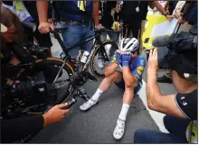  ??  ?? Great Britain’s Mark Cavendish bursts into tears as he is surrounded by photograph­ers after winning Tuesday’s fourth stage of the Tour de France in Fougeres, France. (AP/Tim De Waele)