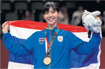  ?? REUTERS ?? Taekwondo star Panipak Wongpattan­akit celebrates winning gold at the 2018 Asian Games.