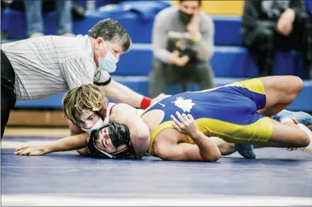  ?? NATE HECKENBERG­ER - FOR MEDIANEWS GROUP ?? West Chester Henderson’s Brett Patton scores near-fall points against Downingtow­n East’s Ryan Loraw in a 7-4win at 132pounds.