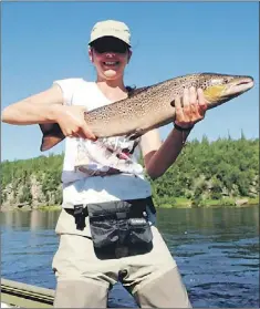  ?? — Photo courtesy of Roman Savitsky ?? Roman Savitsky’s daughter, Daria, with her very first Atlantic salmon.