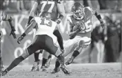  ?? Allen J. Schaben Los Angeles Times ?? USC TAILBACK Ronald Jones II runs past Utah free safety Marquise Blair in the Trojans’ 28-27 victory.