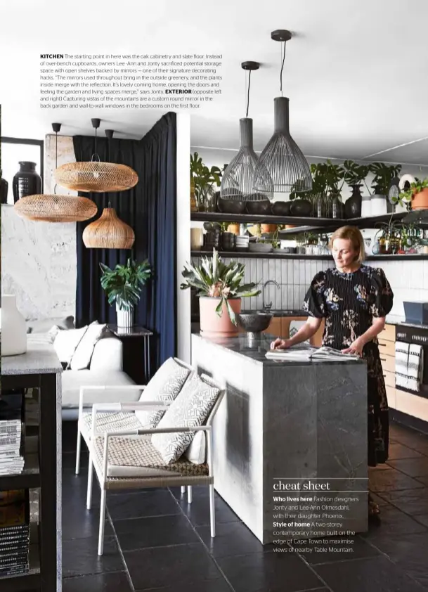  ??  ?? KITCHEN The starting point in here was the oak cabinetry and slate floor. Instead of over-bench cupboards, owners Lee -Ann and Jonty sacrificed potential storage space with open shelves backed by mirrors — one of their signature decorating hacks. “The mirrors used throughout bring in the outside greenery, and the plants inside merge with the reflection. It’s lovely coming home, opening the doors and feeling the garden and living spaces merge,” says Jonty. EXTERIOR (opposite left and right) Capturing vistas of the mountains are a custom round mirror in the back garden and wall-to-wall windows in the bedrooms on the first floor.