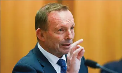  ?? Photograph: Lukas Coch/AAP ?? Former prime minister Tony Abbott told a podcast he believes Scott Morrison overreacte­d to the Covid pandemic.