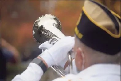  ?? H John Voorhees III / Hearst Connecticu­t Media ?? George Schuster presents “Taps” at the American Legion Post 78 Veterans Day Ceremony at Lounsbury House in Ridgefield.