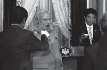  ?? — AFP ?? Prime Minister Narendra Modi raises a toast with Japanese Prime Minister Shinzo Abe during a banquet at the state guesthouse in Tokyo on Monday.