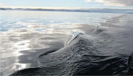  ?? Bloomberg ?? Calm morning seas off Baffin Island, Nunavut.