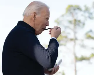  ?? Photo by SAUL LOEB / AFP ?? US President Joe Biden eats a milkshake during a quick stop at Cook Out, a restaurant in Raleigh, North Carolina, following an event to promote his economic agenda on January 18, 2024.