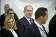  ?? AP PHOTO/ODED BALILTY, FILE ?? FILE - In this Wednesday, Dec. 31, 2014 file photo, Israeli Prime Minister Benjamin Netanyahu, right, and Israel’s First lady Sara Netanyahu arrive for the Likud party primary elections at the in Jerusalem.