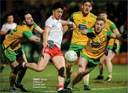  ??  ?? TIGHT: Ronan O’Neill of Tyrone gets closed down