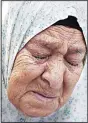 ?? (AFP) ?? Palestinia­n Fahamiya Shamasneh, 75, cries as Israeli policemen evict her from her family home, in which they lived for over half a century, in the Arab neighbourh­ood of Sheikh Jarrah in east Jerusalem on Sept 5, making way for Israelis deemed the legal...