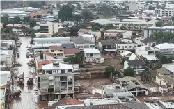  ?? AFP PHOTO ?? NOT OVER YET
An aerial view of the flood-struck town of Mucum in Brazil’s southern Rio Grande do Sul state on May 10, 2024.