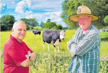  ?? ?? Waikato herdsman Andrew Johnstone (right) with director Costa Botes.