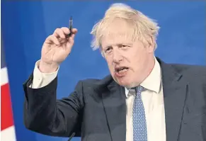  ?? REUTERS ?? Prime Minister Boris Johnson holds a news conference at Downing Street in London on Wednesday in response to the publicatio­n of a report into ‘partygate’.