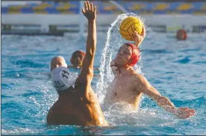  ?? DAVID WITTE/NEWS-SENTINEL ?? Above: Lodi's Victor Plunkett (7) takes a shot during Lodi's 13-7 loss to Pitman on Nov. 6 at Tokay High's pool. Below: Tokay goalkeeper Alanna Stoops, left, goes up to block a shot by Lodi's Aiyana Evans (15) during Lodi's 12-2 victory at Tokay.