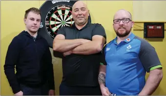  ??  ?? Will O’Shea, Peter Heslin and David O’Leary from Bweeng picked up a few handy tips from two-time world darts champion Adrian Lewis at the Kilbrin Community Centre.