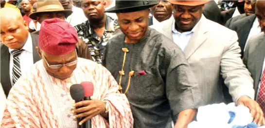  ?? PHOTO: NAN ?? From left: Former President Olusegun Obasanjo, Governor Chibuike Amaechi of Rivers and Deputy Governor Tele Ikuru, during the inaugurati­on of G.U. Ake Road in Port Harcourt by the former president yesterday.