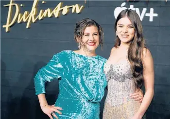 ?? JOHN LAMPARSKI/GETTY ?? Creator Alena Smith and actor Hailee Steinfeld attend a “Dickinson” premiere in 2019 in New York City.