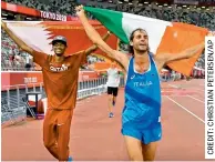  ??  ?? Gold medalists Mutaz Essa Barshim (left) of Qatar and Gianmarco Tamberi of Italy celebrate on the track